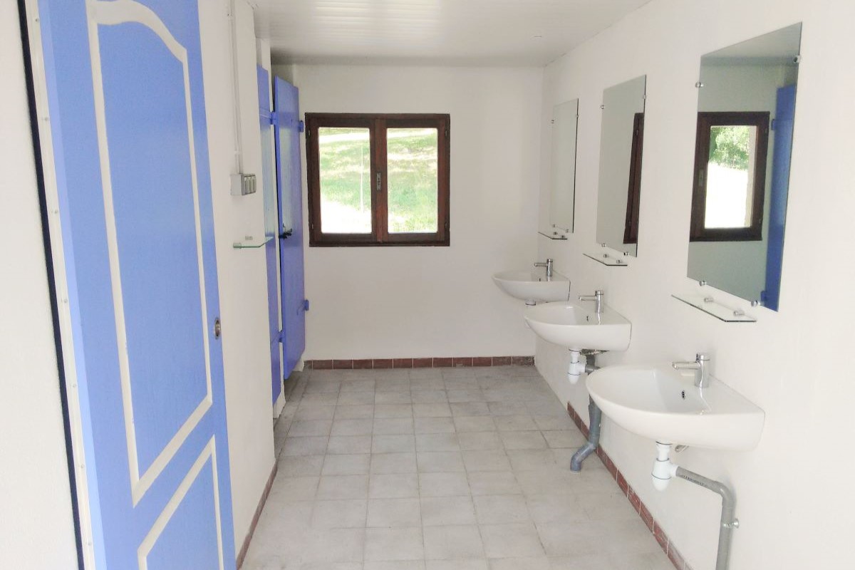The toilets on the shower side